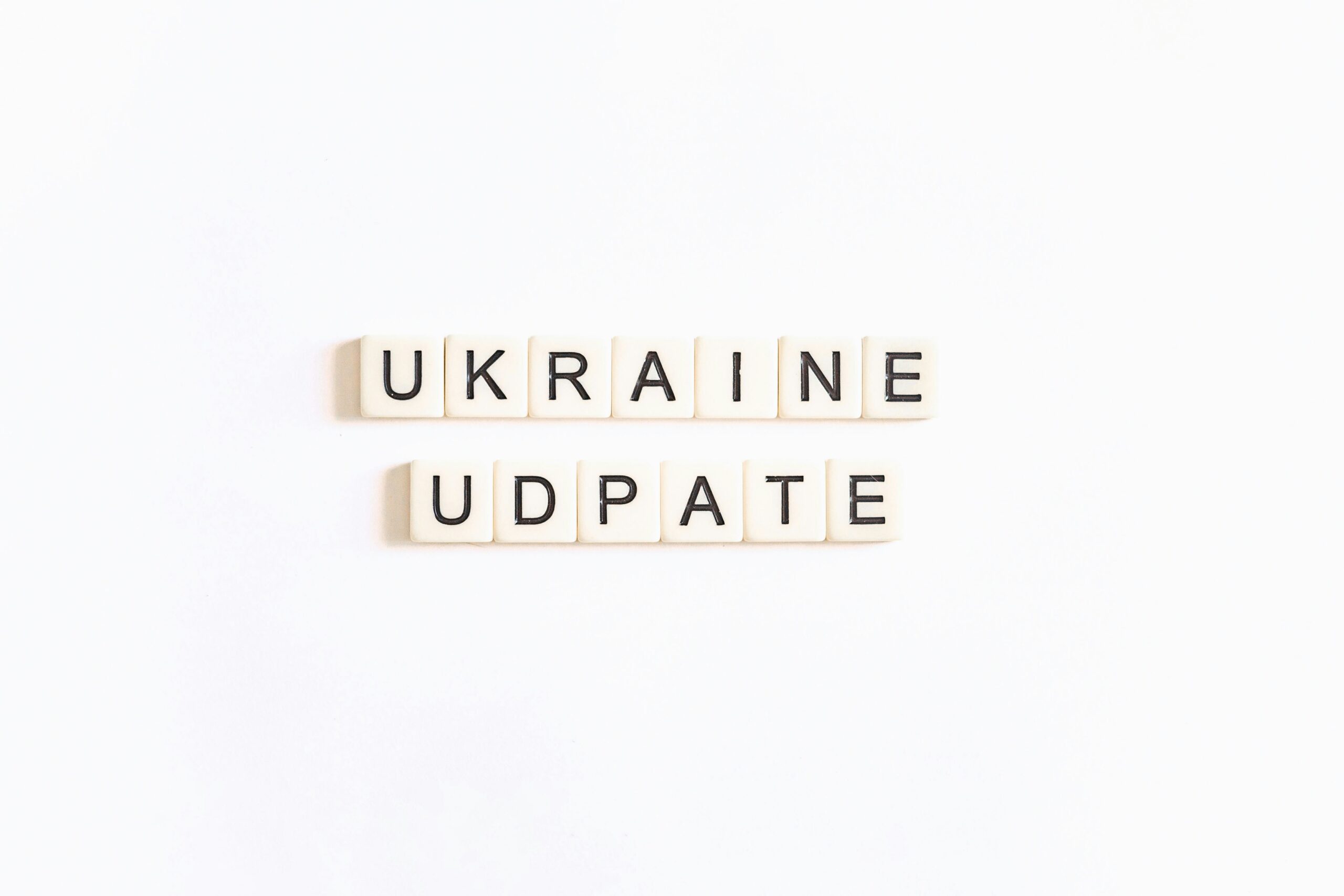 two scrabble tiles spelling ukraine and ukraine update